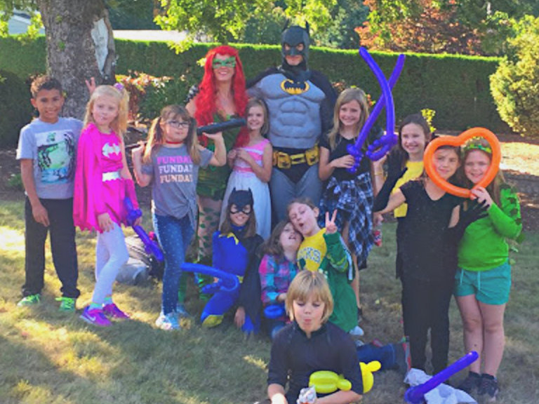 Batman party character from Blast Kids' Parties with party guests.